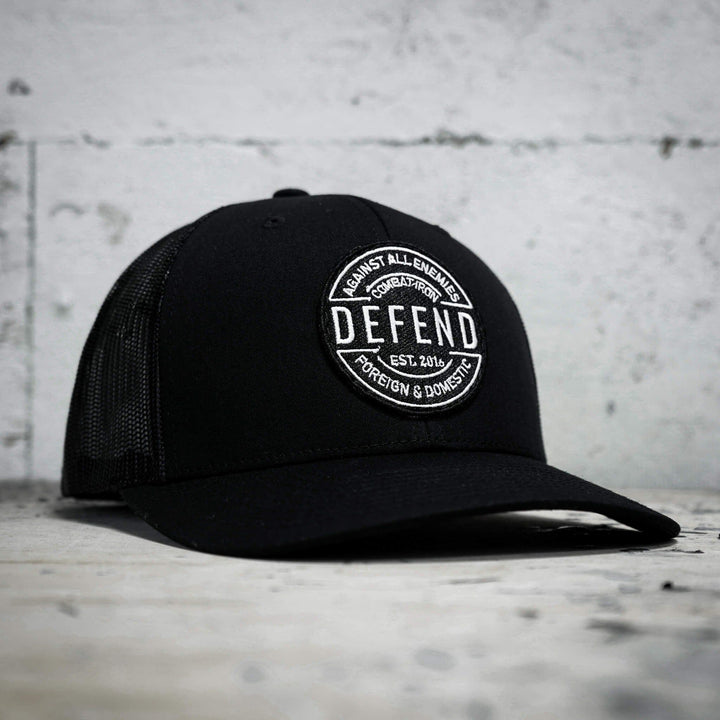A retro rope snapback with the words “Defend against all enemies, foreign & domestic” on the front #color_black-black