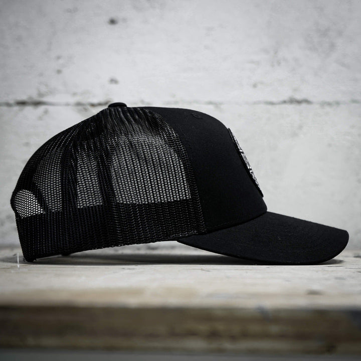 A retro rope snapback with the words “Defend against all enemies, foreign & domestic” on the front #color_black-black
