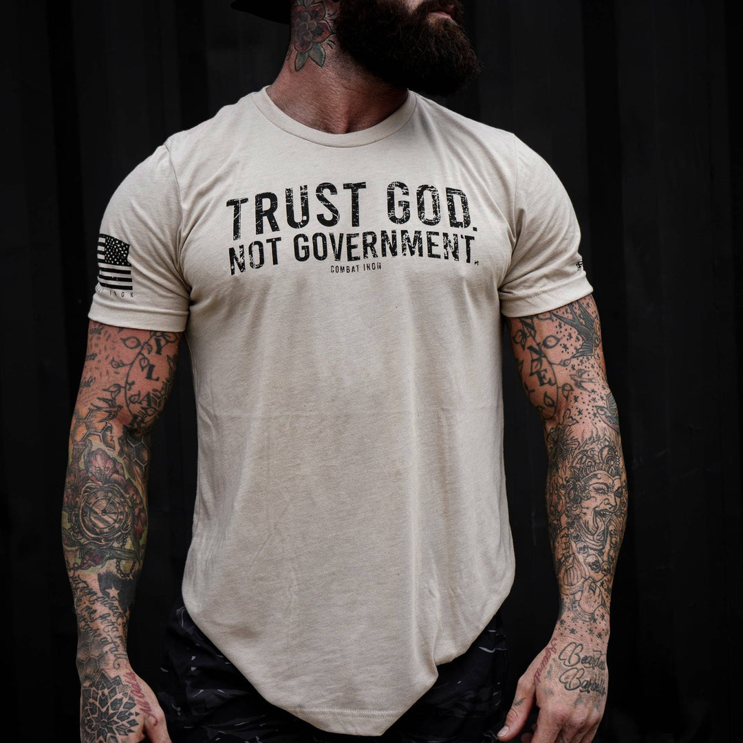 Men’s black t-shirt with the message “Trust God. Not government.” with letters and a American flag on the sleeve #color_tan