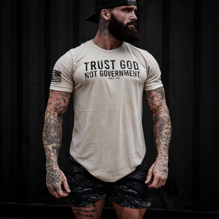 Men’s black t-shirt with the message “Trust God. Not government.” with letters and a American flag on the sleeve #color_tan