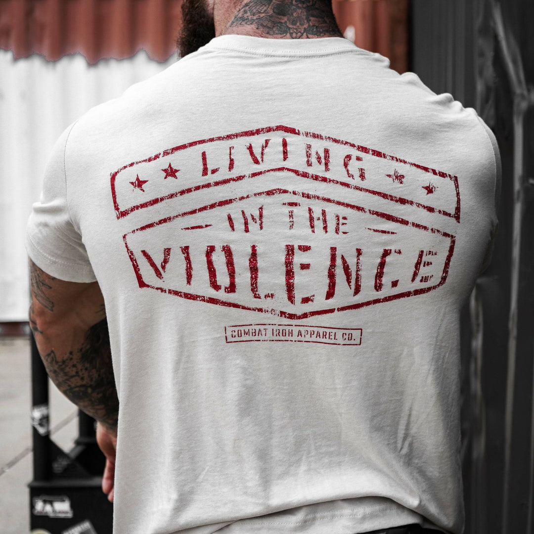 Men’s t-shirt with the words “Living in the violence” #color_tan