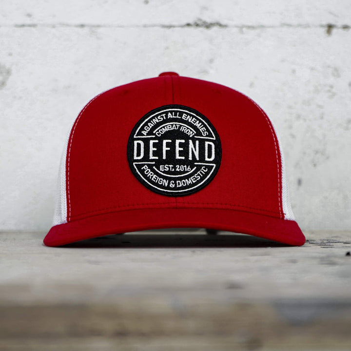 A retro rope snapback with the words “Defend against all enemies, foreign & domestic” on the front #color_red-white