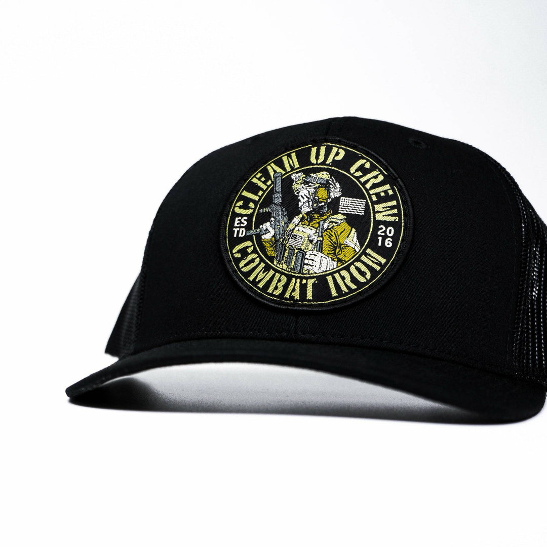 A black mid-profile mesh snapback with a patch that says “Clean up crew” in yellow #color_black-black