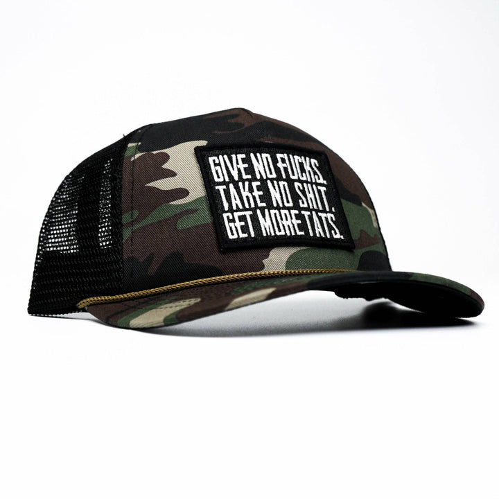 Give no fucks. Take no shit. Get more tats. Mid-profile mesh snapback cap in dark camo with a black and white patch on the front #color_bdu-camo-black