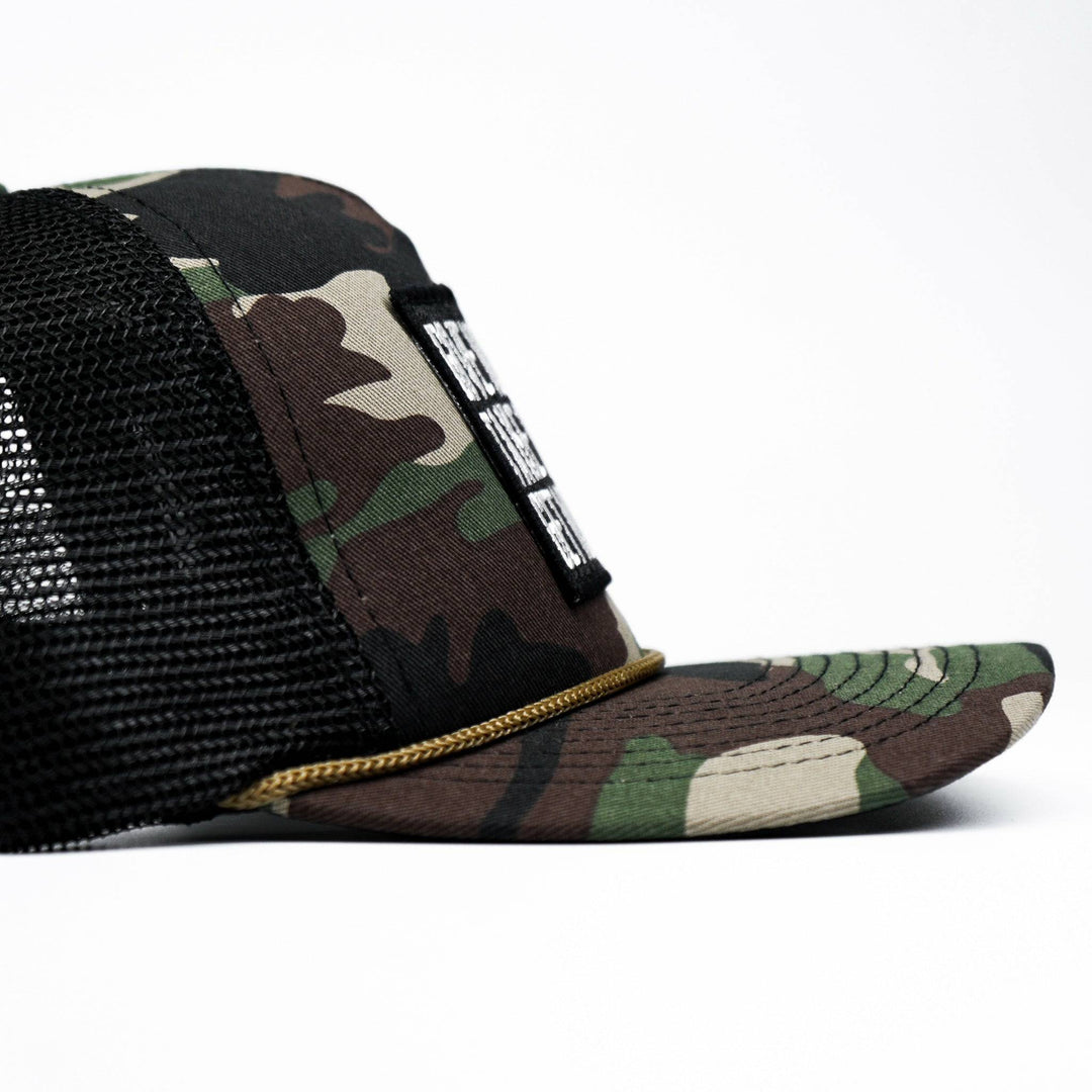 Give no fucks. Take no shit. Get more tats. Mid-profile mesh snapback cap in dark camo with a black and white patch on the front #color_bdu-camo-black