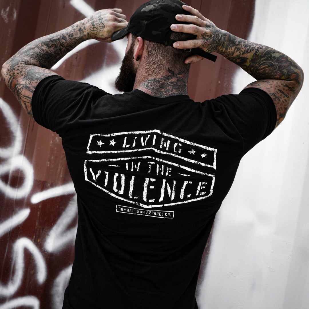 Men’s black t-shirt with the words “Living in the violence” #color_black