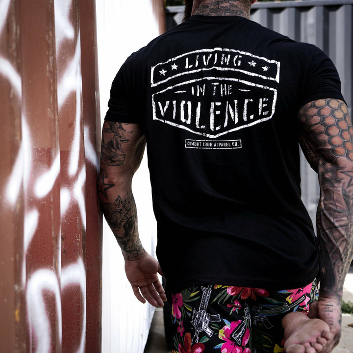 Men’s black t-shirt with the words “Living in the violence” #color_black