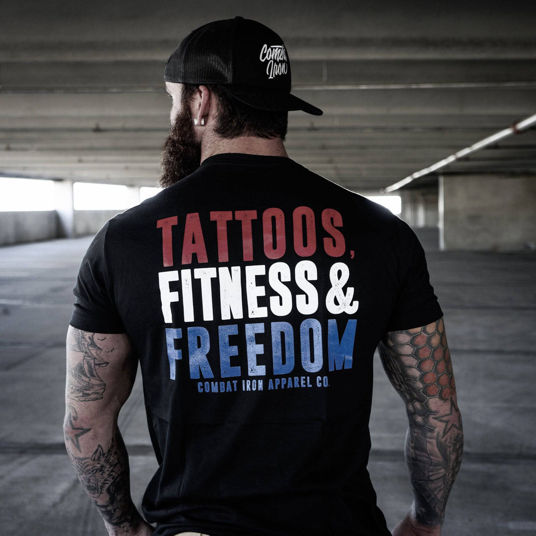 Men’s black t-shirt with the words “Tattoos, fitness & freedom” in red, white, and blue on the front #color_black