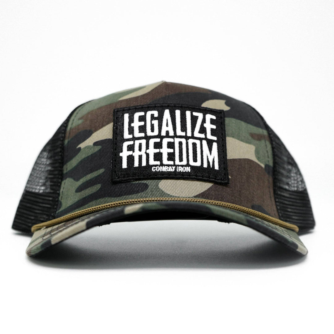 A camo retro rope snapback with a patch saying “Legalize freedom” #color_bdu-camo-black
