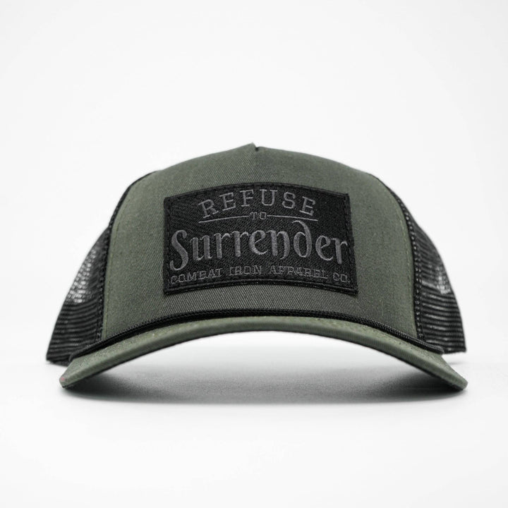A camo retro rope snapback with a black patch that says “Refuse to surrender” #color_military-green-black