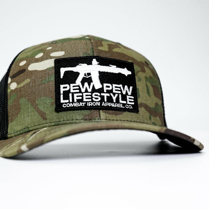 A mid-profile mesh snapback hat with a “Pew pew lifestyle” patch on the front #color_multicam-black