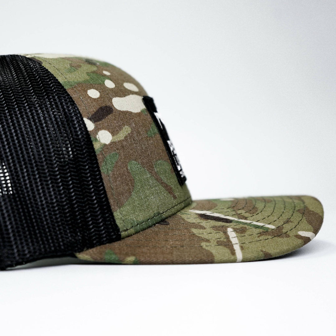 A mid-profile mesh snapback hat with a “Pew pew lifestyle” patch on the front #color_multicam-black