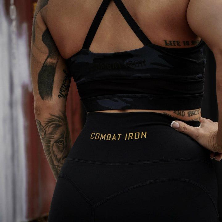 Ladies' luxe high-waisted shorts for women, all black with the CMBT logo #color_black