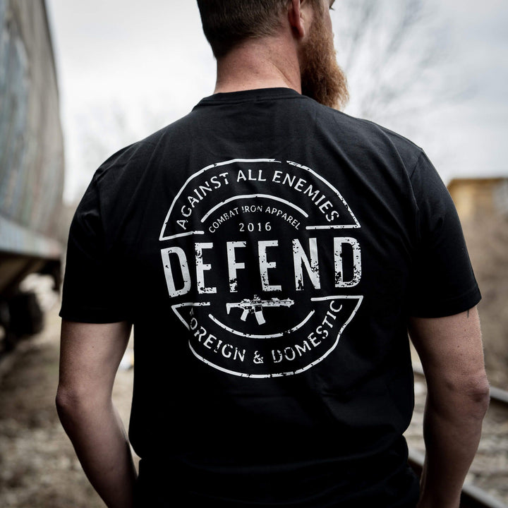 Men’s black t-shirt with the message “Defend against all enemies, foreign & domestic” #color_black