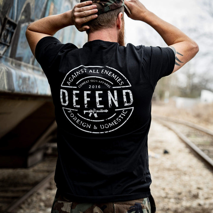 Men’s black t-shirt with the message “Defend against all enemies, foreign & domestic” #color_black