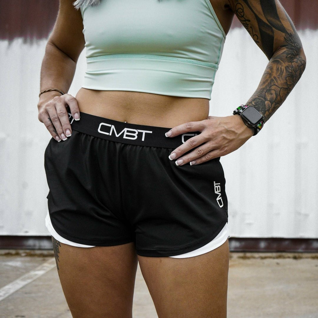 CMBT cross-training ladies’ shorts, all black with the CMBT logo in white #color_black