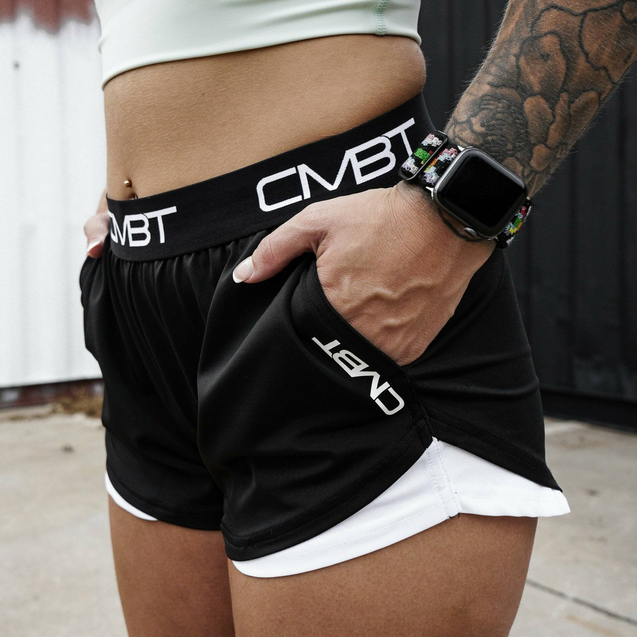 CMBT cross-training ladies’ shorts, all black with the CMBT logo in white #color_black