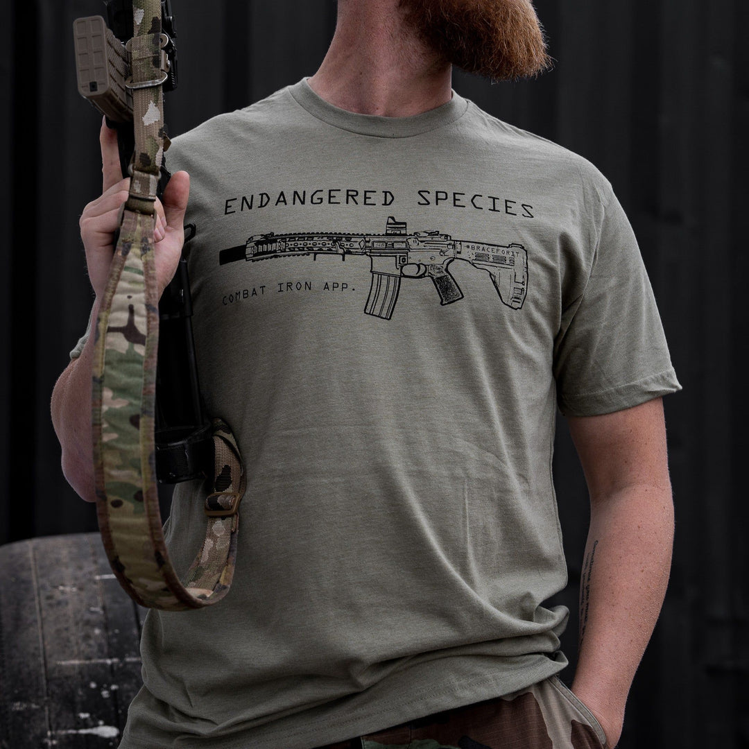 Endangered species with a rifle on it men’s t-shirt in military-green #color_military-green