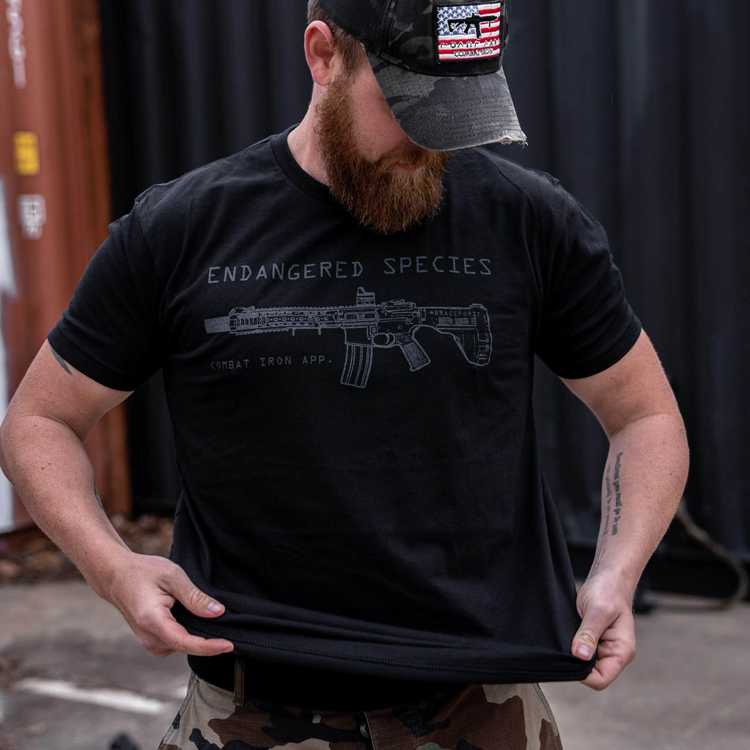 dangered species with a rifle on it men’s t-shirt in black #color_black