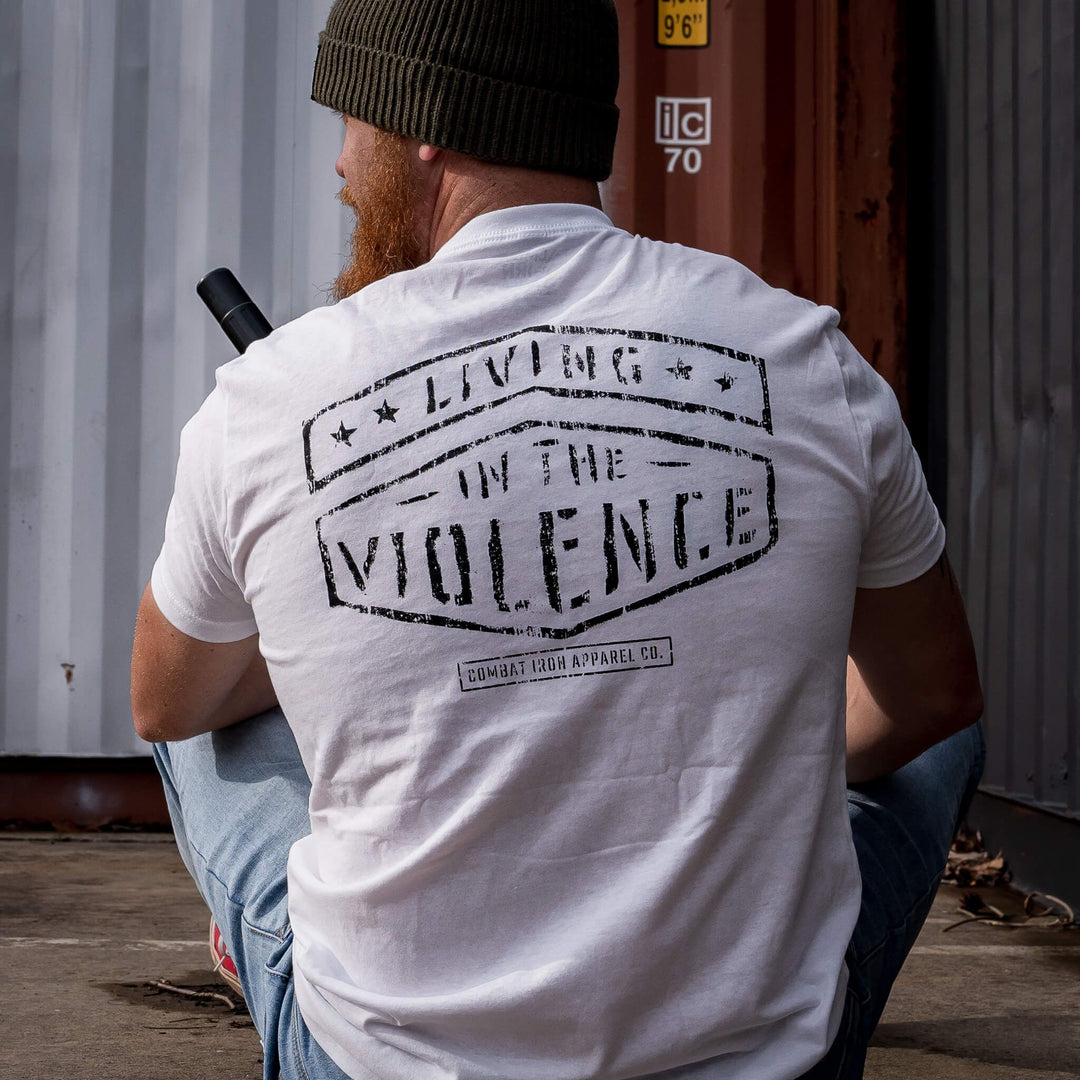 Men’s t-shirt with the words “Living in the violence” #color_white