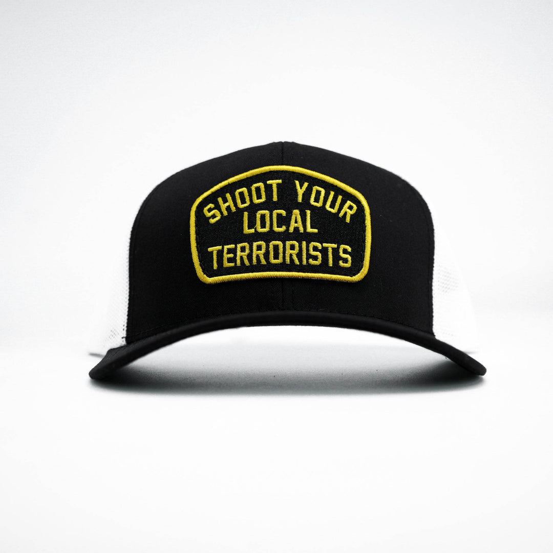 Mid-profile mesh snapback hat in black with a patch that says “Shoot your local terrorists” in yellow #color_black-white