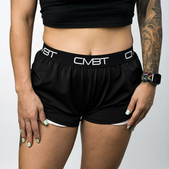 CMBT cross-training ladies’ shorts, all black with the CMBT logo in white #color_black