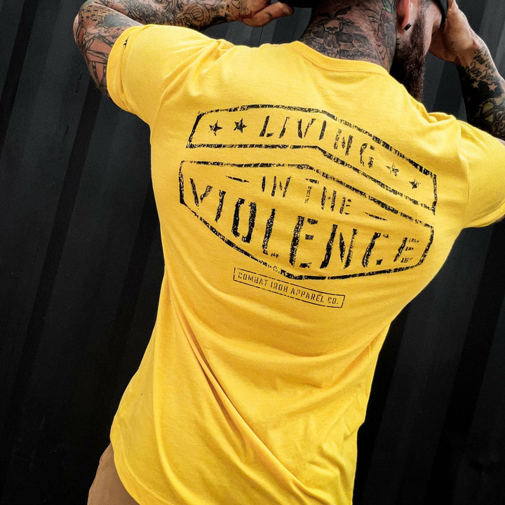 Men’s t-shirt with the words “Living in the violence” #color_yellow