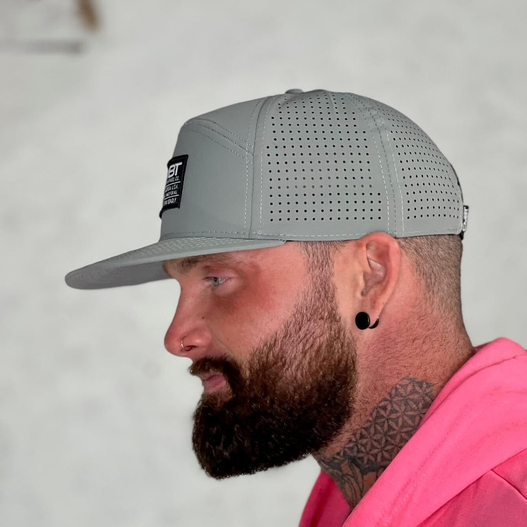 CMBT pro performance hybrid mesh hat in grey with a black and white patch on the front #color_gray
