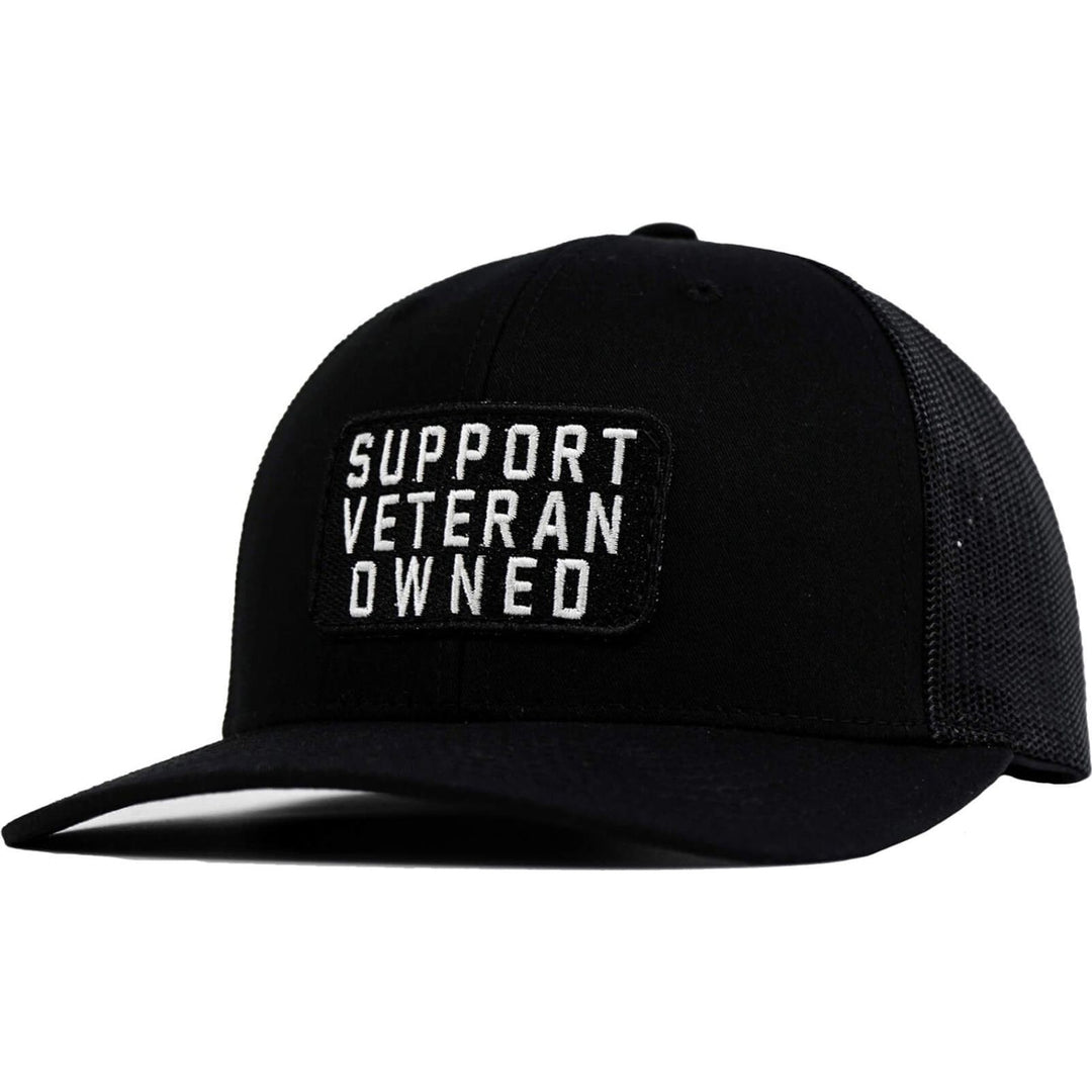 A mid-profile mesh snapback with a patch that says “Support veteran owned” in white letters #color_black-black
